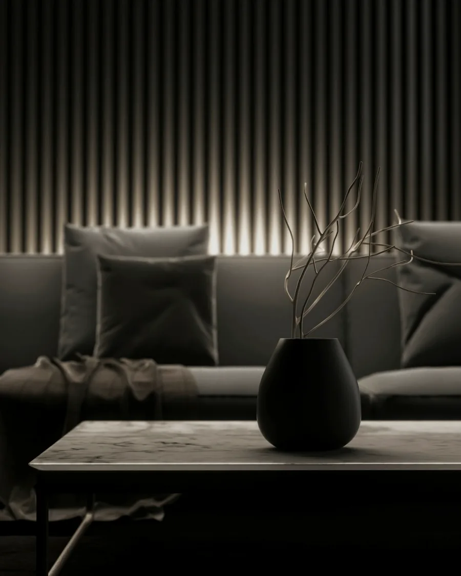 A dark, softly lit modern living room interior
